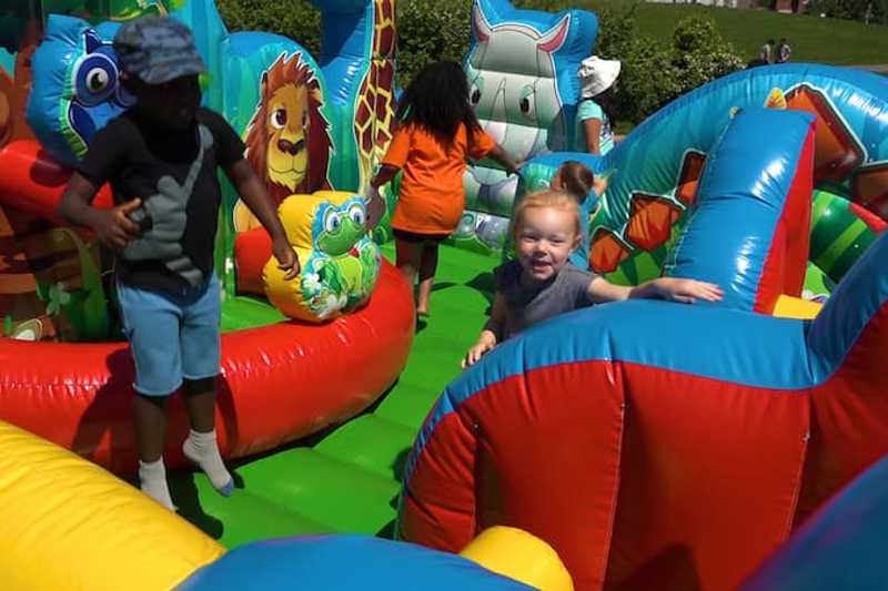 Bouncy playground slide at Big Give event.